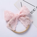 Close-up of baby headbands featuring light pink embroidered lace bows and nylon elastic bands - 10*7CM / Light Pink