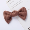 Detailed close-up of brown knit bow hair clip showing textured waffle knit fabric - Ribbed Texture Bow / Brown Red