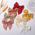 Set of seven six-inch jacquard cotton bow hair clips in various elegant colors - Random Color