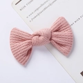 Close-up of pink waffle knit bow hair clip with textured fabric for baby girls - Waffle Texture Bow / Pink