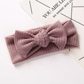 Detailed waffle knit texture of baby bow headband in soft dusty rose pink color - Pink