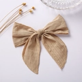 Detail of 6 inch jacquard cotton bow hair clip with textured fabric and long ribbons - Khaki