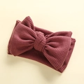 Close-up of wine red waffle knit baby headband featuring a large handmade double bow - 17*9 cm / Korean Pink