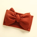 Detailed waffle knit texture and large bow on a caramel baby headband accessory - 17*9 cm / Dark Brown