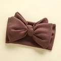 Detailed view of the brown waffle knit fabric and large bow on the infant headband - 17*9 cm / Coffee