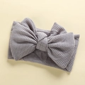 Macro shot showing the waffle knit texture and handmade bow on this baby headband - 17*9 cm / Gray