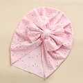 Detail of baby lace turban hat in light pink featuring a large decorative bow - Light Pink