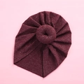 Detailed view of dark red knit baby turban hat featuring a signature doughnut knot design - Burgundy