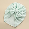 Detail of mint green lace baby turban with hollow embroidery and large bow decoration - Mint Green