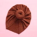 Close-up of baby ribbed knit donut turban hat in dark orange with vertical texture - Coffee