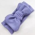 Detail of lavender waffle knit baby headband featuring a large handmade double bow - 17*9 cm / Purple