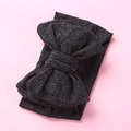 Detailed texture of dark grey knitted wide headband with oversized matching bow - Black