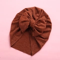 Detail of soft ribbed knit baby turban showing the textured fabric and large bow - 18x21cm / Coffee