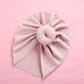Close-up of pink ribbed knit baby turban featuring a donut knot and soft texture - Dark Pink