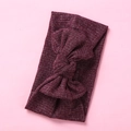 Detail of ribbed texture and tied bow on burgundy stretch knit baby headband - Burgundy