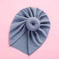 Detail view of the soft ribbed knit fabric and doughnut knot on the blue baby turban - Blue