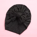 Detail shot of the soft knitted texture and bow on this dark grey baby turban hat - 18x21cm / Black