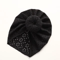 Detail of black eyelet lace baby turban hat with a top knot donut on white background - 21*19 cm / Black