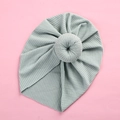 Detail of light blue baby turban hat with ribbed knit texture and donut knot design - Bean Green