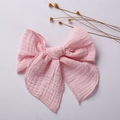 Detailed close-up of a pink muslin bow clip with soft textured cotton gauze fabric - 15*15 cm / Light Pink