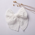 Detail of a white muslin cotton bow hair clip for girls with natural soft fabric texture - 15*15 cm / White