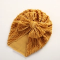 Detail der Baby Turban Mütze in Senfgelb aus elastischem Rippstoff mit großer Schleife - 18*21 cm / Ingwergelb