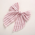 Close-up of pink and white striped fabric bow hairpin with fine sewing details - Dusty Pink