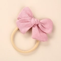 Detail of pink linen bow on soft nylon baby headband with natural woven texture - Light Pink