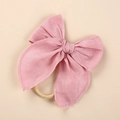 Close-up of pink linen bow headband with soft fabric texture and elastic band - Light Pink