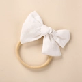 Detail of white linen bow on soft khaki nylon headband for newborn photography - White