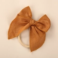Linen bow headband for baby girls in caramel color with a beige elastic nylon band - Ginger Yellow