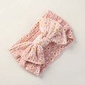 Detailansicht Baby Stirnband in Rosa mit Gänseblümchen-Print und großer Strickschleife - Rosa