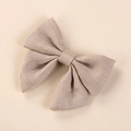 Macro shot of light linen hand-knotted bow hair clip showing detailed fabric texture - 8*6.5 cm / Khaki