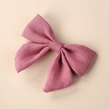 Detail shot of dusty pink linen bow hair clip showing natural fabric texture and weave - 8*6.5 cm / Deep Pink