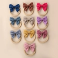 Set of 10 solid color linen baby bow headbands with elastic nylon hairbands in various shades - Random Color