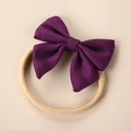Detailed macro view of deep purple linen bow headband with soft nylon baby hair band - Deep purple