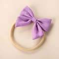 Detail of purple linen bow on soft nylon baby headband with textured fabric detail - Violet