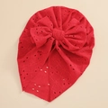 Detail of red baby turban hat with hollow eyelet embroidery and a large bow - Red