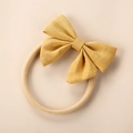 Detail of yellow linen bow on soft nylon headband for baby hair accessory - Yellow