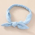 Detail view of light blue soft cotton gauze baby headband with cute bow and elastic band - Sky Blue