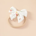 Detailed macro view of soft cotton floral bow on a high-elasticity nylon baby headband - Red Floral