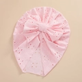 Detailed view of pink baby turban hat featuring eyelet knit fabric and a large bow - Light Pink