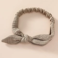 Detail of baby cotton headband showing soft linen texture and elastic bow knot - Dark Khaki