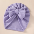Macro detail of lavender waffle knit fabric and bow on the infant newborn turban hat - 21*19 cm / Purple