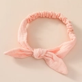 Detailed view of the breathable pink cotton fabric and soft elastic band of the baby headband - Carmine Pink