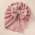 Macro detail of baby pink waffle knit turban hat with a large bow decoration - 21*19 cm / Dusty Pink