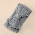 Close-up of grey jacquard nylon baby headband with soft elastic knit and large bow - Gray