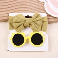 Detail view of mustard yellow bow headband and bear ear sunglasses on a wooden tray - Bow Headband And Bear Sunglasses / Ginger Yellow