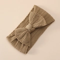 Detailed macro view of khaki knit wide headband with elastic cable texture and bow - Dark Brown