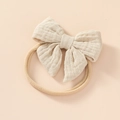 Soft cream cotton baby headband featuring a large double-layer bow and elastic nylon strap - Khaki